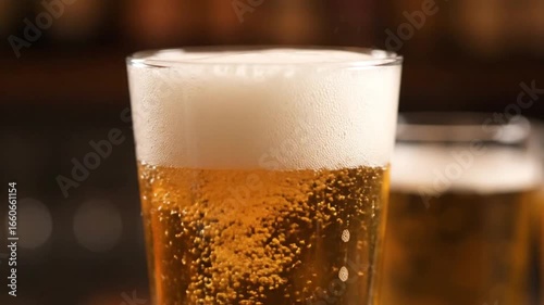 Wallpaper Mural Pouring Cold Beer into Glass, Frothy Head. Torontodigital.ca