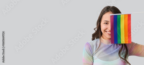 Young woman with LGBT flag ...