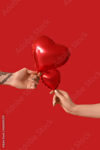 Man and woman with air ball...