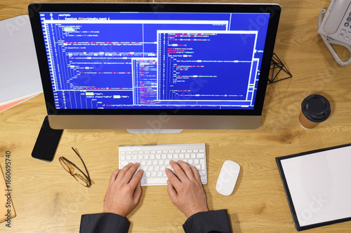 Programmer working with com...