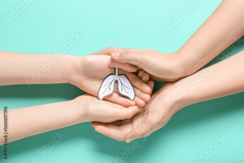 Hands of woman and child wi...