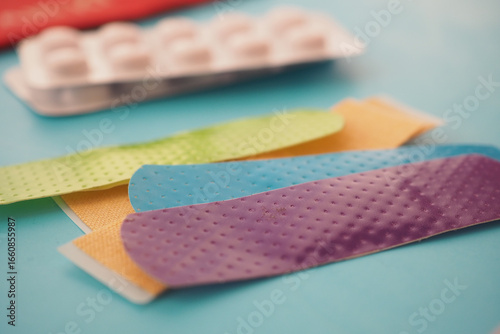 Fotografi Colorful adhesive bandages on a bright background