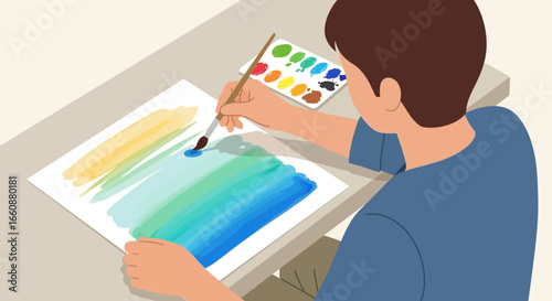 Young man paints vibrant watercolor landscape, focused on artistic creation.