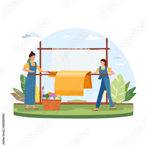 Two women hanging laundry outdoors together.