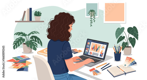 A woman working on a laptop at a desk, surrounded by plants and design tools.