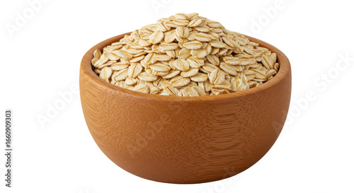 A wooden bowl filled with rolled oats isolated on white background showcasing a natural food setting