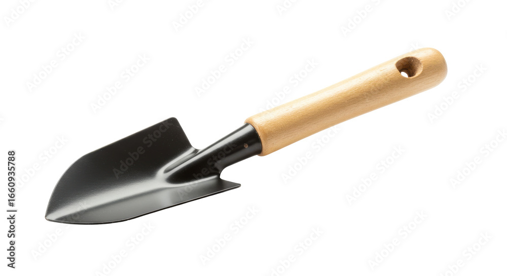 Fototapeta premium Close up of a garden trowel with a wooden handle ready for planting in a garden setting