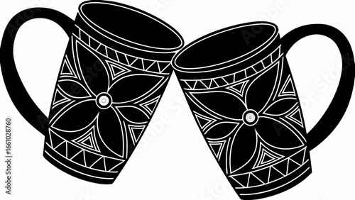 Two black mugs with floral and triangle designs clinking together in a celebratory gesture on white silhouette