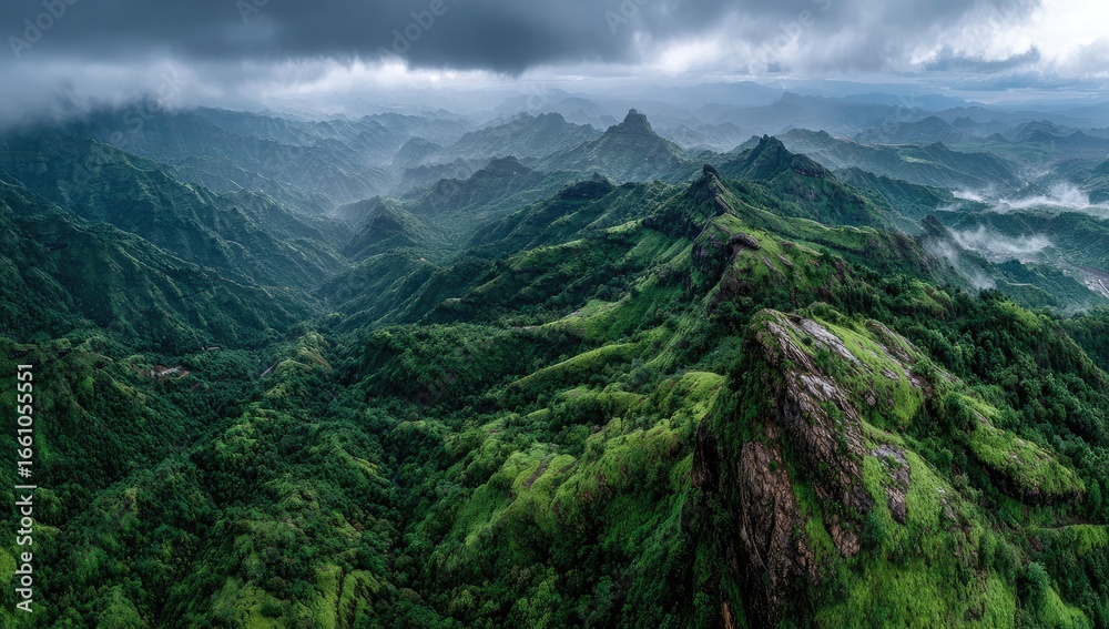 Fototapeta premium Lush mountain range, dramatic clouds