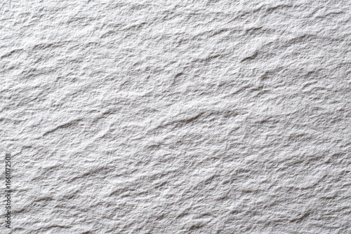 Close-up of textured, light gray stone surface