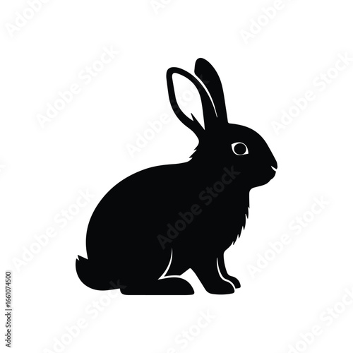 Silhouette of a black rabbit with long ears sitting upright and facing right on a white background
