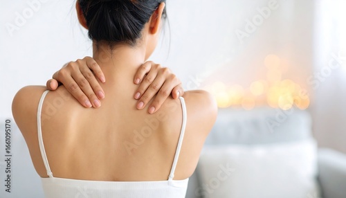 Woman massaging her neck and shoulders