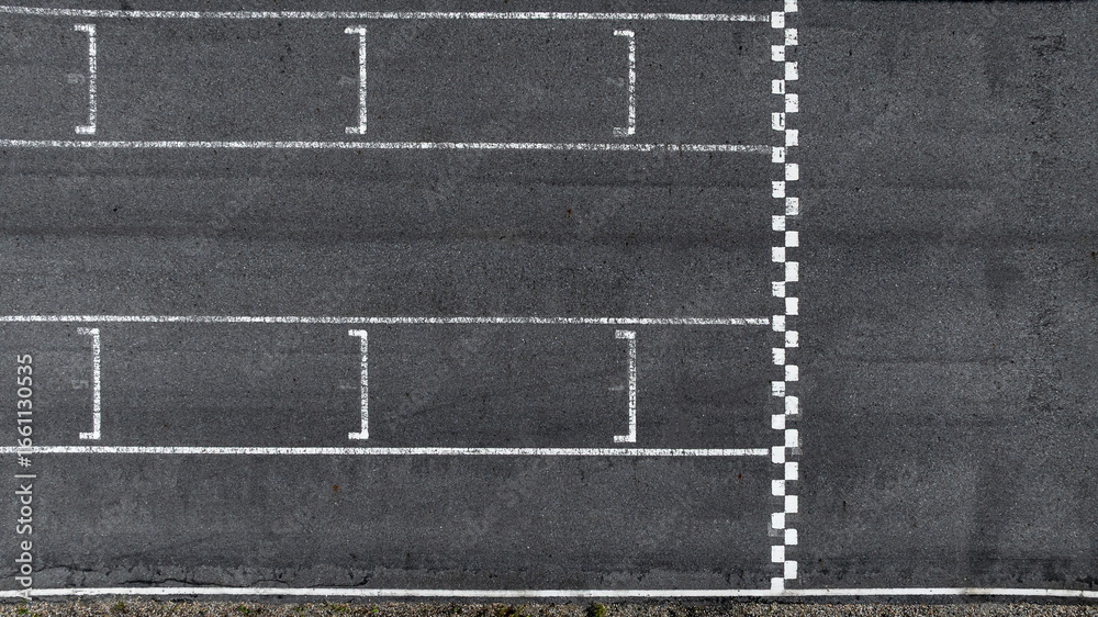 Fototapeta premium Start and Finish motor race line asphalt on grand prix street circuit, Checkered line on racing motorsport race track, Auto or automobile background concept.