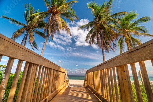 Fototapeta Naklejka Na Ścianę i Meble -  Tropical beach boardwalk on a sandy beach