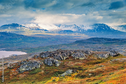 Принти на полотні Scenic mountainous landscape view with storm clouds and autumn colours