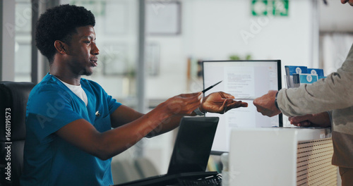 Foto Man, nurse or receptionist with paperwork for consent form or medical appointment document