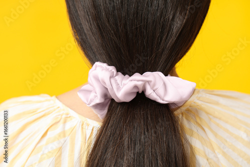 Woman with ponytail and sil...