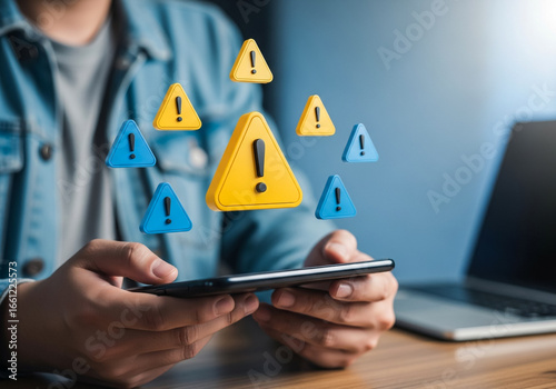 Digital Alert: An individual navigates their device as digital hazard symbols float, representing the risks and warnings inherent in the modern digital landscape. Emphasizing awareness, safety.