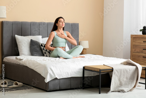 Beautiful young woman doing...