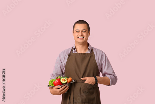 Young man in apron with fre...