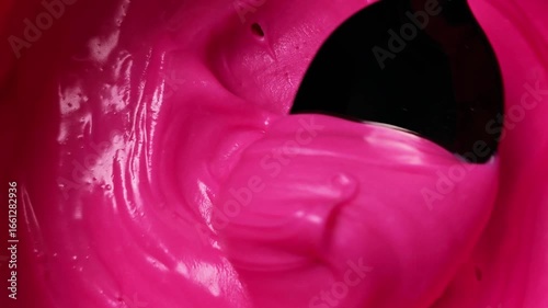Vibrant Pink Cream Dynamic Mixing CloseUp Smooth Texture Intense Color.