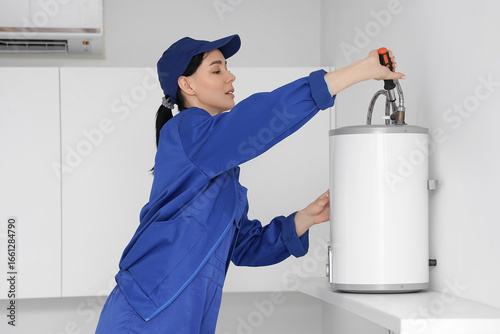 Female worker with screwdri...