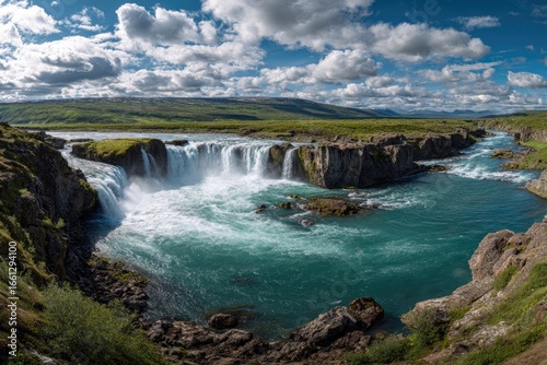 Panoramic view of cascading waterfalls in a valley