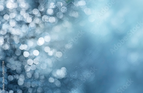 Abstract blurred background of light-blue and silvery bokeh circles