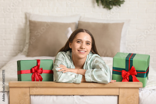 Young happy woman lying wit...