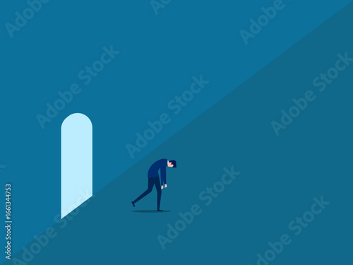 businessman walks sadly out of the office door