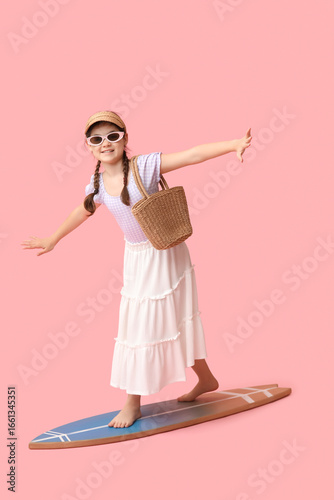 Cute girl with wicker bag o...