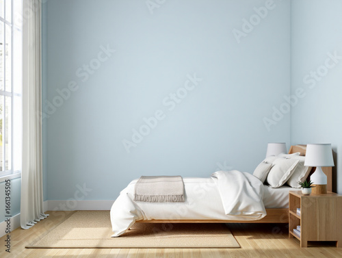 Modern minimalist bedroom interior design with light blue walls and wooden furniture creating a serene and peaceful ambiance