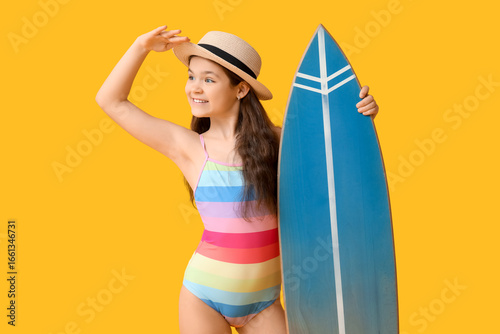 Cute girl in swimsuit with ...