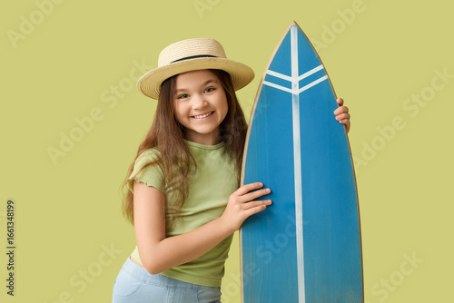 Cute girl with surfboard on...