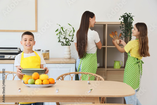 Cute boy with his family se...