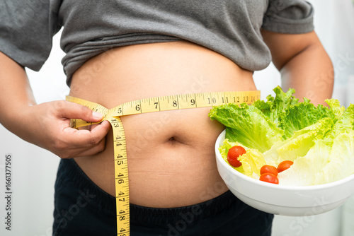 Cuadro en lienzo Asian woman with fat belly big size overweight and obesity with healthy food