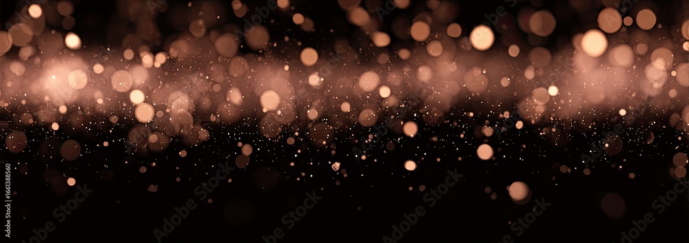 Fototapeta premium Abstract bokeh background of light reddish-brown circles on a black backdrop