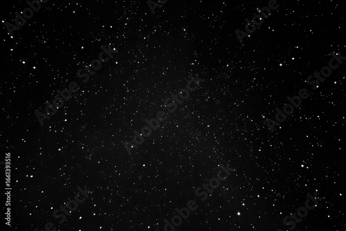 A vast expanse of black night sky, densely speckled with numerous small, white stars