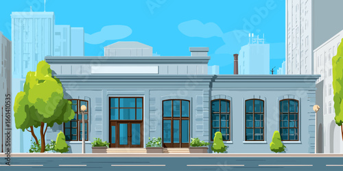 Classic light blue city building with large glass windows and a prominent entrance.