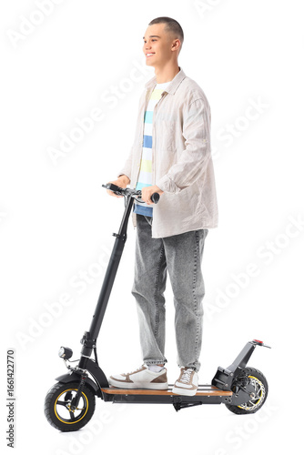 Teenage boy riding electric...