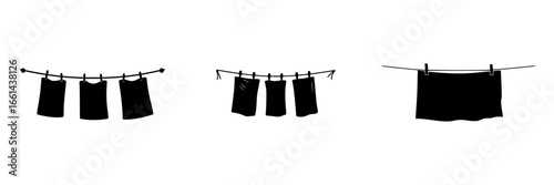 Laundry hanging on a clothesline in a sunny backyard during a warm afternoon