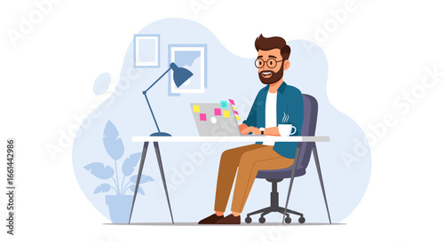 Man with beard and glasses focused on laptop in a modern home office. Illustrates remote work, freelancing, and digital productivity.