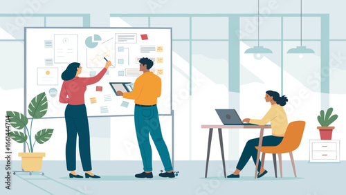 Diverse business team collaborating in a modern office, analyzing data on a whiteboard. A colleague works on a laptop, depicting productivity, teamwork, and strategic planning.