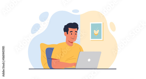 Smiling man diligently working on his laptop in a comfortable home environment, showcasing productivity and digital lifestyle.