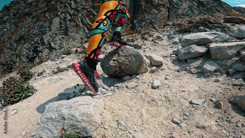Traveler climbing a mountain trail