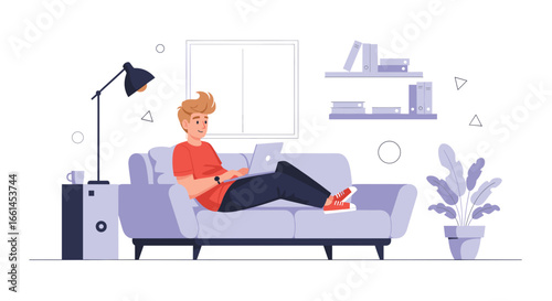 Young man comfortably working from home on his laptop, lounging on a sofa in a modern living room. Depicts remote work, online learning, and flexible lifestyle.