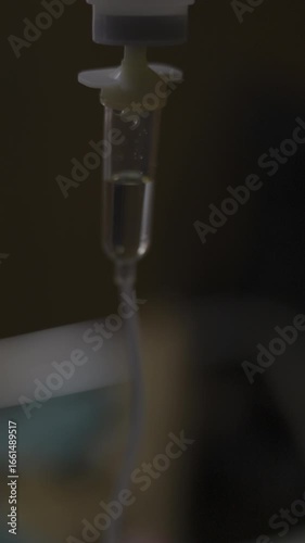 Closeup Of IV Drip In Hospital, Cinematic footage of medical equipment providing patient care, perfect for healthcare videos, hospital documentaries, and corporate training films.