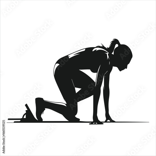 Athlete in starting blocks ready to sprint