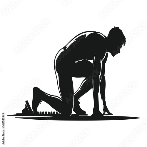 Silhouette of a sprinter in the starting blocks ready to race