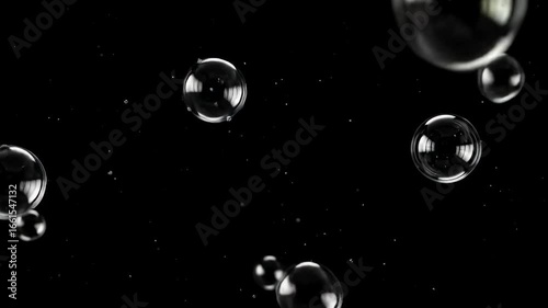 Floating Bubbles on Black Background: An Abstract Image of Soap Bubbles